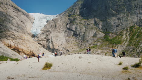 People-Are-Visiting-The-Famous-Brixdal-Glacier-In-Norway-Tourism-In-The-Nordic-Countries-And-Scandin