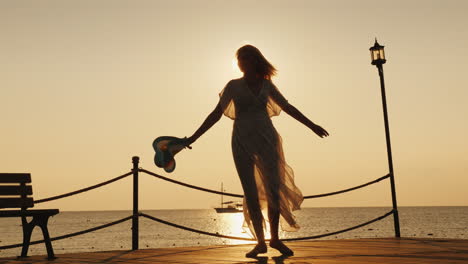 A-Woman-Meets-The-Dawn-At-Sea-Emotionally-Spinning-With-A-Hat-In-His-Hand-On-The-Pier-Dream-Of-Trave