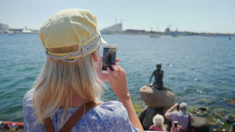 The-Tourist-Photographs-The-Famous-Statue-Of-The-Little-Mermaid-In-The-Harbor-Of-Copenhagen-Denmark