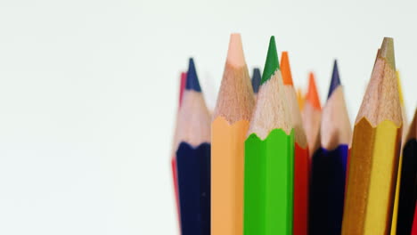 A-Set-Of-Multi-Colored-Pencils-On-A-Black-Background