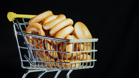 Small-Bagels-In-A-Shopping-Trolley-In-Miniature-4k-Video