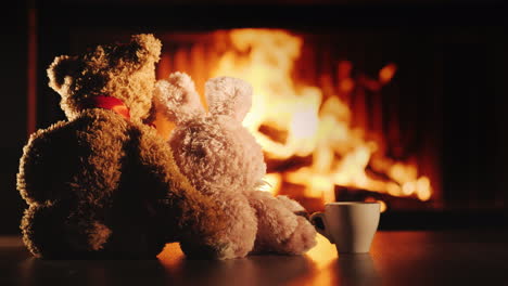 Tea-By-The-Fireplace-Two-Friends-Bear-And-Hare-Look-At-The-Fireplace-Next-To-A-Cup-Of-Tea