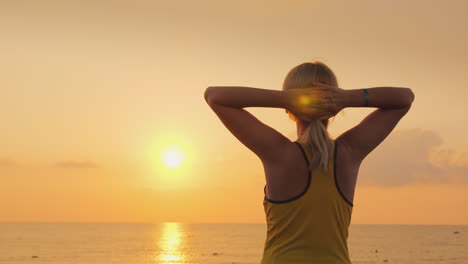 Fitness-Woman-Admiring-The-Sunrise-Over-The-Sea-Freshness-Beauty-And-Health-Concept