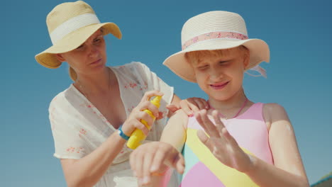 Mom-Puts-Sunscreen-On-The-Skin-Of-Her-Daughter-Rest-And-Sun-Protection