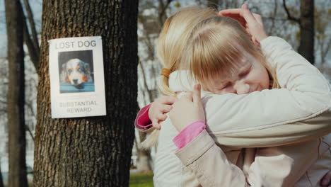 Mom-Soothes-The-Girl-Who-Lost-The-Dog-On-The-Tree-Hangs-The-Announcement-Of-The-Missing-Puppy