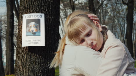 Mom-Soothes-The-Girl-Who-Lost-The-Dog-On-The-Tree-Hangs-The-Announcement-Of-The-Missing-Puppy