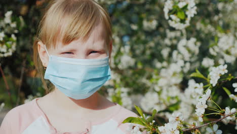 Portrait-Of-A-Child-In-A-Gauze-Bandage-Against-The-Background-Of-Flowering-Trees-Allergy-Problems