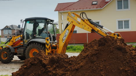 Excavator-Digs-A-Trench-Near-Private-Cottages