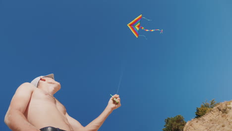 A-Man-Is-Trying-To-Fly-A-Kite-There-Is-Not-Enough-Wind-For-A-Good-Rope-Tension