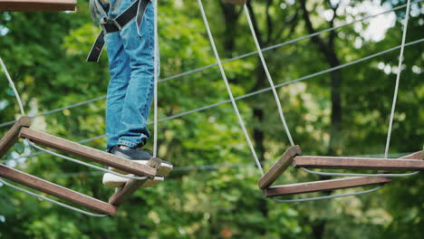 The-Boy-Is-Stuck-On-A-Rope-Obstacle-Can-Not-Make-A-Step-Overcome-The-Fear-Concept