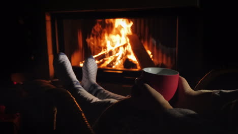 Relax-With-A-Cup-Of-Tea-By-The-Fireplace-Winter-Escape-From-All-Problems
