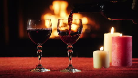 The-Waiter-Pours-Wine-Into-The-Glasses-In-The-Background-A-Fire-Burns-In-The-Fireplace