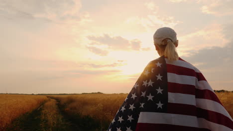 Farmer-With-Usa-Flag-Walking-On-A-Wheat-Field-Sun-At-Sunset-Steadicam-Shot