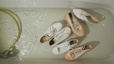 Dirty-Women's-Shoes-Float-In-The-Bathtub-And-Sap