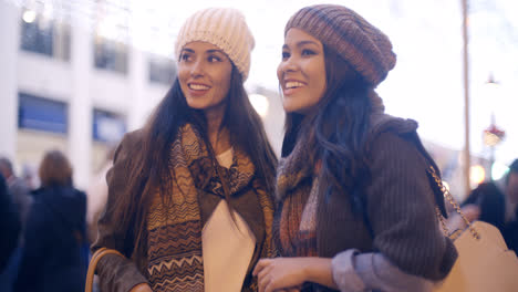 Two-women-chatting-in-a-street-in-winter