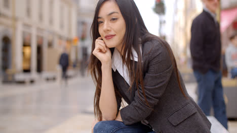 Young-woman-sitting-waiting-for-someone