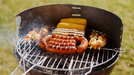Sausages--corncobs-and-kebabs-grilling-on-a-BBQ