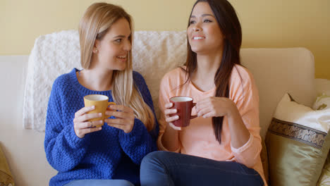 Two-pretty-young-women-enjoy-a-relaxing-coffee