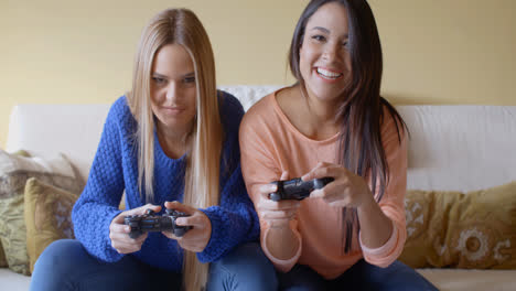 Excited-girls-playing-video-games-at-home