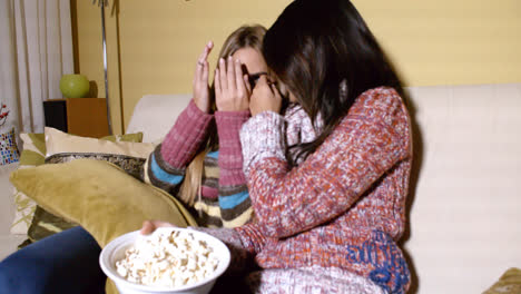 Girls-Covering-Faces-While-Watching-Horror-Movie