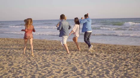 Young-People-Running-On-The-Beach