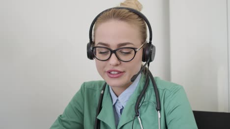Female-doctor-using-headset-and-having-conversation-with-patient