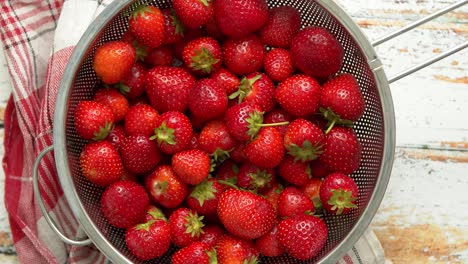 Delicious-healthy-fresh-strawberries-placed-in-metal-strainer--Organic-natural-food-concept-