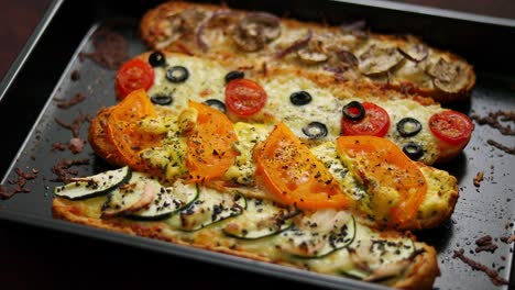 Delicious-hot-sandwich-baguettes-baked-with-tuna--cheese--tomatoes--olives--courgette-and-mushrooms