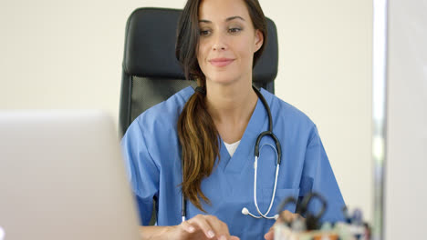 Beautiful-female-doctor-at-laptop-computer