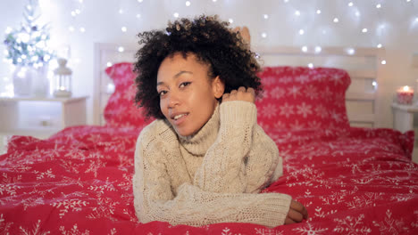 Pretty-young-woman-in-a-festive-bedroom