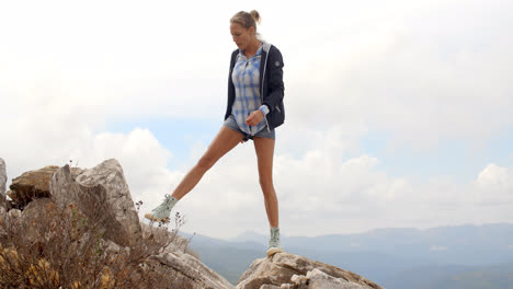Sporty-Woman-Standing-on-Top-of-Rock