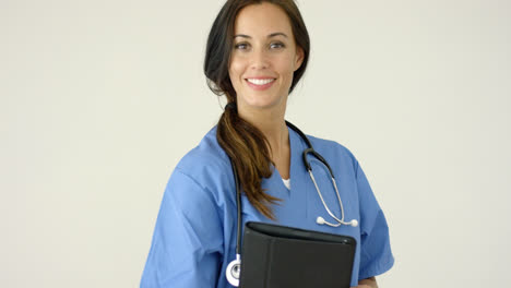 Smiling-young-female-physician-smiles-at-camera