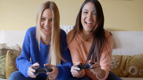 Excited-girls-playing-video-games-at-home