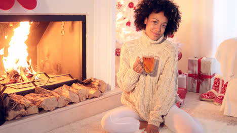 Happy-young-woman-relaxing-at-Christmas