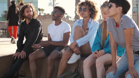 Content-young-friends-chilling-on-city-seafront