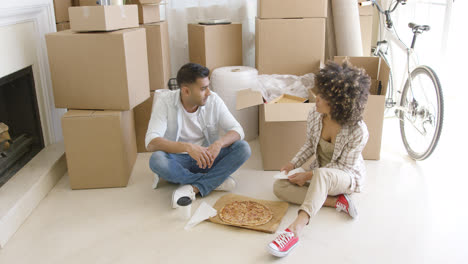 Young-couple-taking-a-break-from-moving-house
