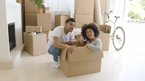 Happy-young-couple-moving-house-together