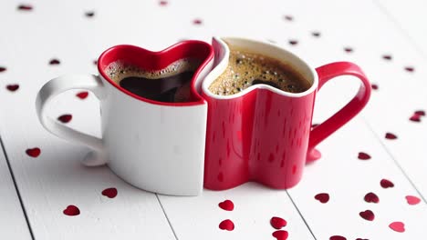 Two-heart-shaped-coffee-cups-conected-with-each-other