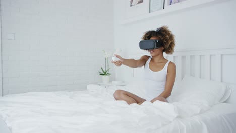 Excited-woman-gaming-in-VR-glasses