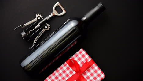 Red-wine-bottle--corkscrew-and-boxed-christmas-gift