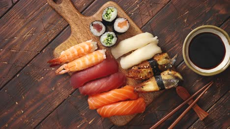Sushi-Set--Different-kinds-of-sushi-rolls-on-wooden-serving-board