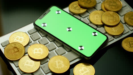 Phone-with-green-screen-and-bitcoins