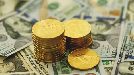 Stack-of-golden-bitcoin-on-bills