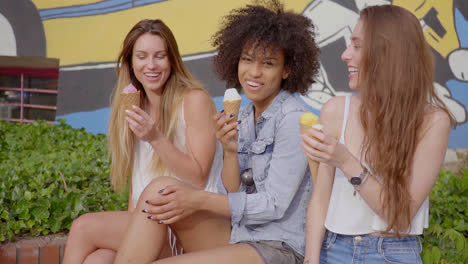 Young-women-sitting-and-having-ice-cream