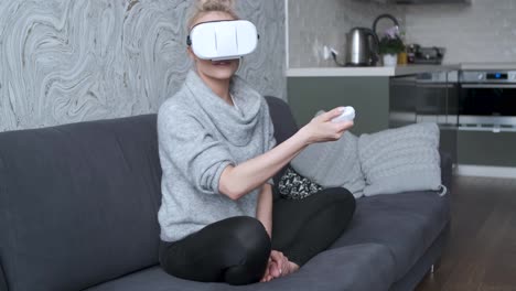 Young-woman-watching-videos-or-playing-with-VR-glasses-on-head