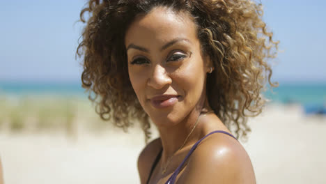 Pretty-curly-haired-woman-on-shore