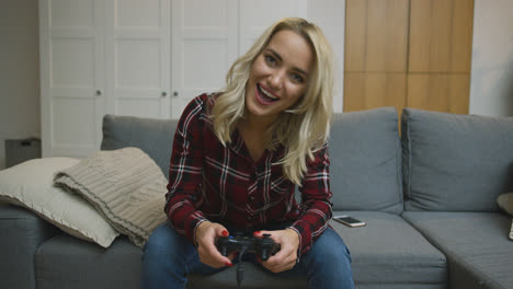 Cheerful-woman-playing-video-game