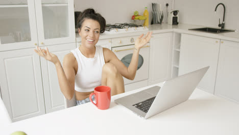 Expressive-young-woman-with-laptop