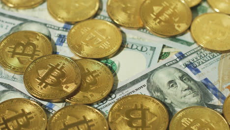 Heap-of-gold-bitcoins-on-bills