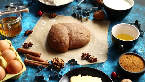Gingerbread-dough-placed-among-various-ingredients--Christmas-baking-concept
